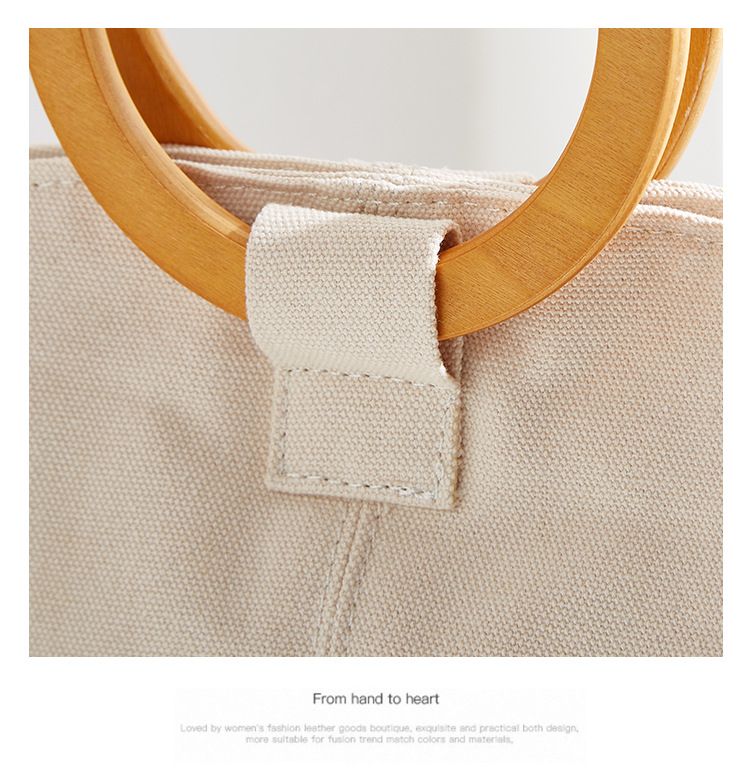 Borsa versatile e di grande capienza in versione coreana, la nuova borsa da donna minimalista in tela di quest'anno, manico in legno_voghion.com
