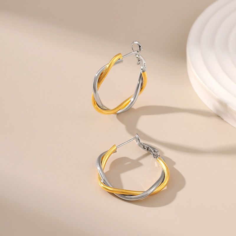 Gold and silver contrasting design personality earrings K real gold plated niche metal texture cross twist earrings_voghion.com