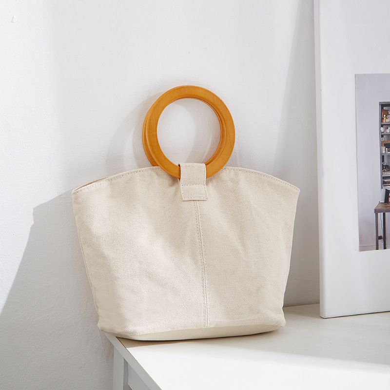 Borsa versatile e di grande capienza in versione coreana, la nuova borsa da donna minimalista in tela di quest'anno, manico in legno_voghion.com