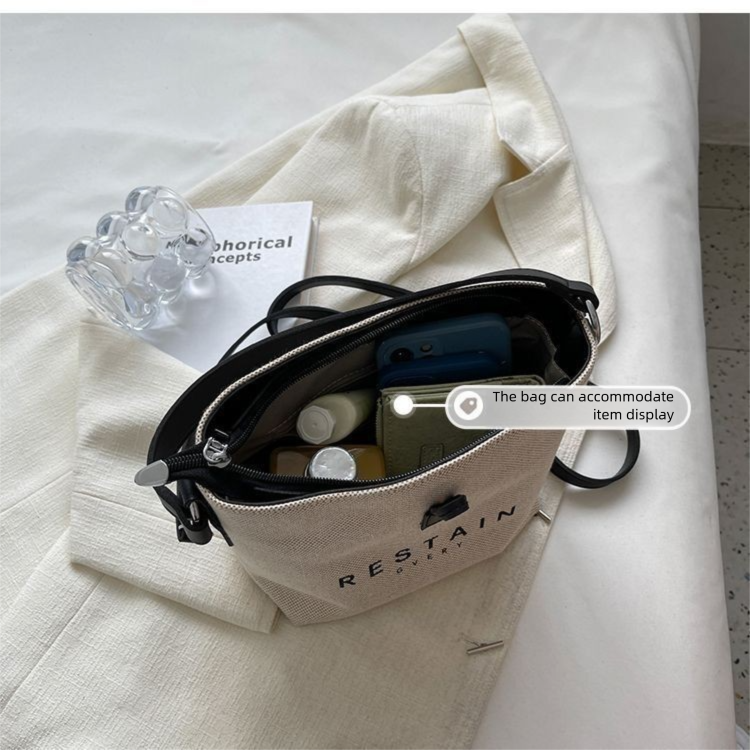 Design de nicho da moda deste ano 2025 Novas bolsas femininas casuais versáteis de lona crossbody de mão_voghion.com