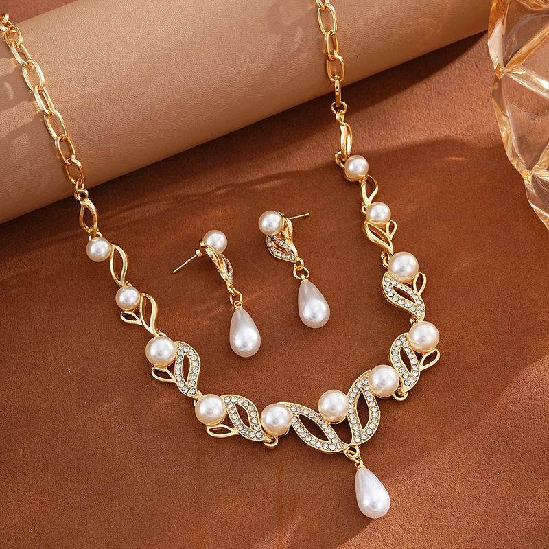 Collana e orecchini con perle a goccia d'acqua, set di accessori da sposa, temperamento alla moda, set da due pezzi da donna all'ingrosso_voghion.com