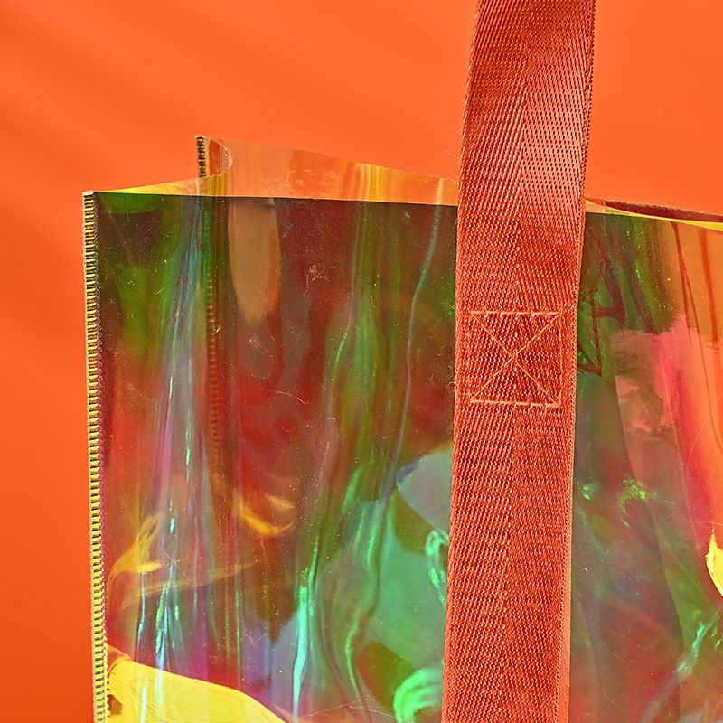 Straight color PVC laser bag for women's clothing store, fashionable high-end shopping handbag_voghion.com