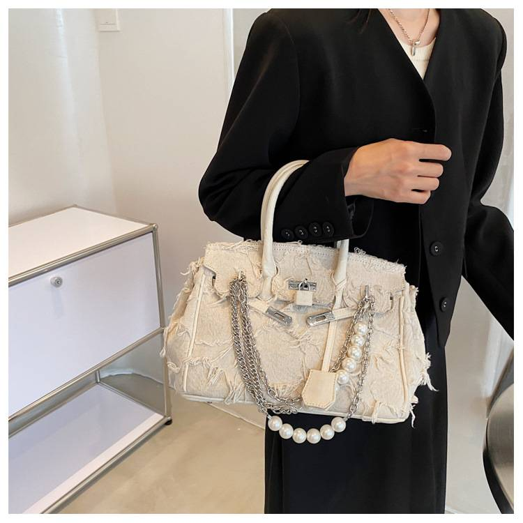 A niche design pearl women's chain bag with a new vintage rag beggar platinum single shoulder crossbody light luxury handbag_voghion.com
