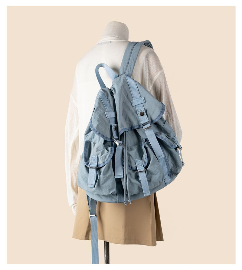 Simplified Korean version large capacity new drawstring casual flip cover commuting lightweight student backpack women's_voghion.com