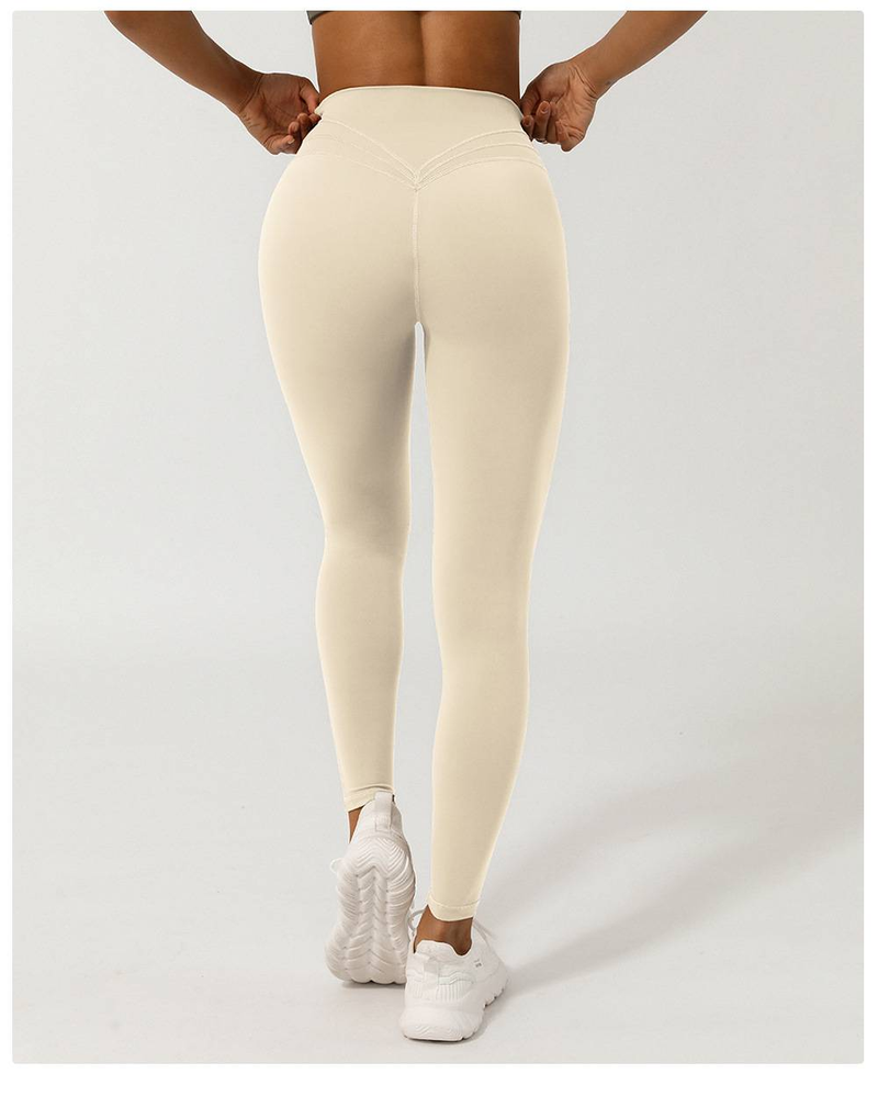 Women's Nude Cross V-shaped Nine Point Yoga Pants Without T-line Peach Hip Lifting Quick Drying Sports Pants_voghion.com