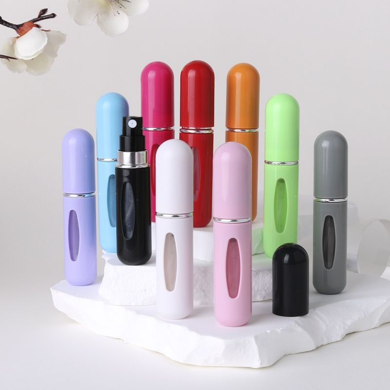 Bonita botella de perfume de plástico, muestra, portátil, de viaje, con base de carga directa, botella pulverizadora de alta gama._voghion.com