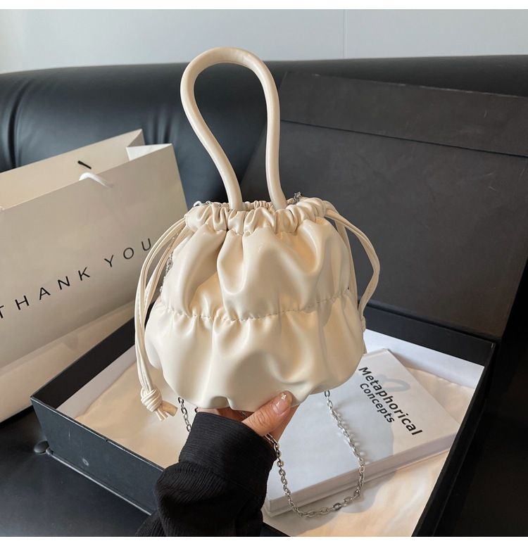 Korean high-end soft glutinous cloud bucket bag, niche pleated handbag, cute ins shoulder crossbody bag_voghion.com