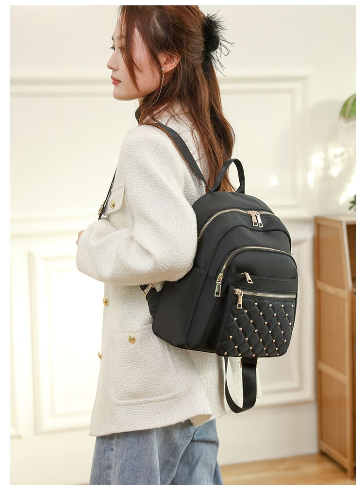 Spring summer Oxford grid patterned backpack with fashionable rivets for outdoor travel and commuting_voghion.com