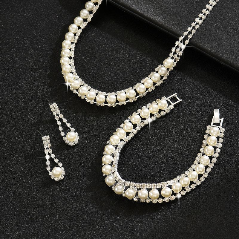 Collana, orecchini, bracciale, perle, eleganti gioielli da sposa, accessori per abiti_voghion.com