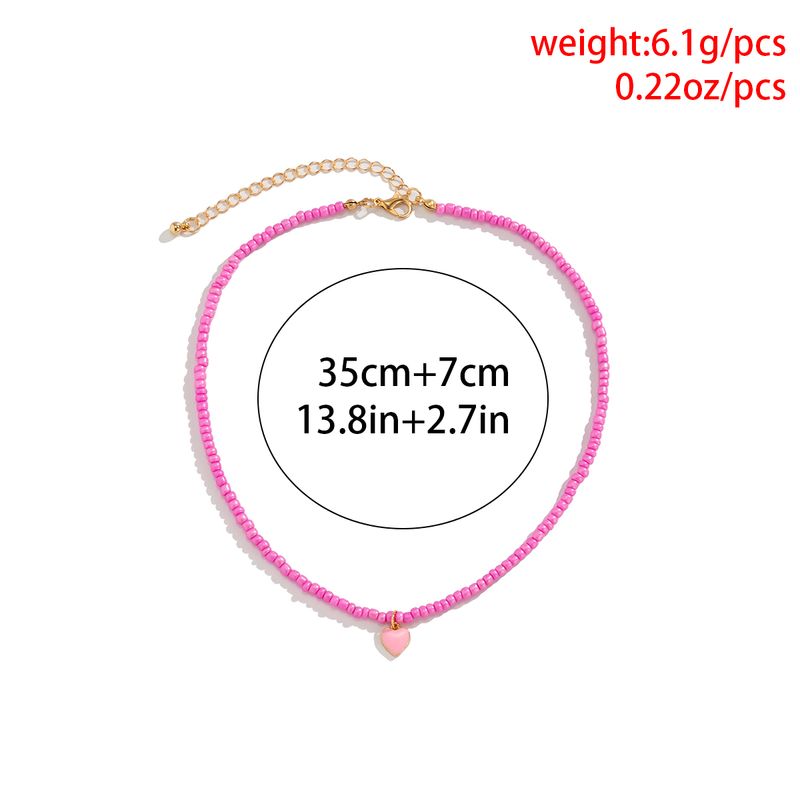 Pronta consegna Piccole perline di semi con ciondolo a forma di cuore Collana per donna Trendy Ladies Perline Catena sul collo Choker Collare 2024 Moda_voghion.com