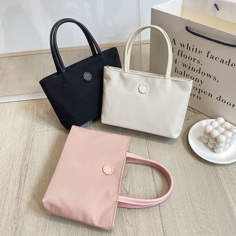 2022 Sommer Neue Canvas Handheld Mini Tote Mode Einfache Pendler Damentasche_voghion.com