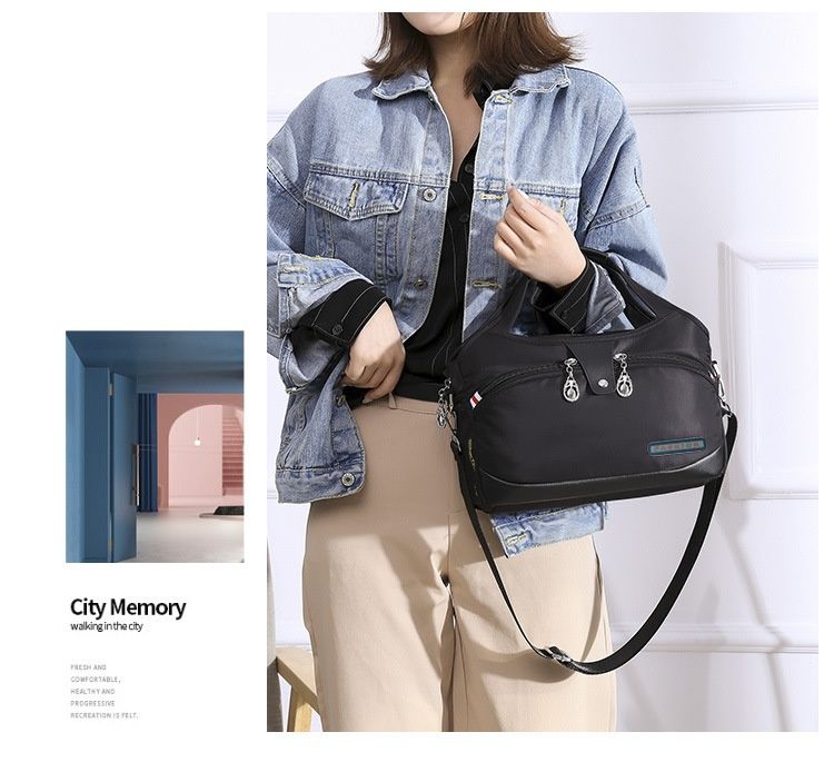Modern och lätt Oxfordtyg Koreansk version Dam Casual Stor Kapacitet Vattentät Rese Shopping Handhållen Axelväska Crossbody_voghion.com