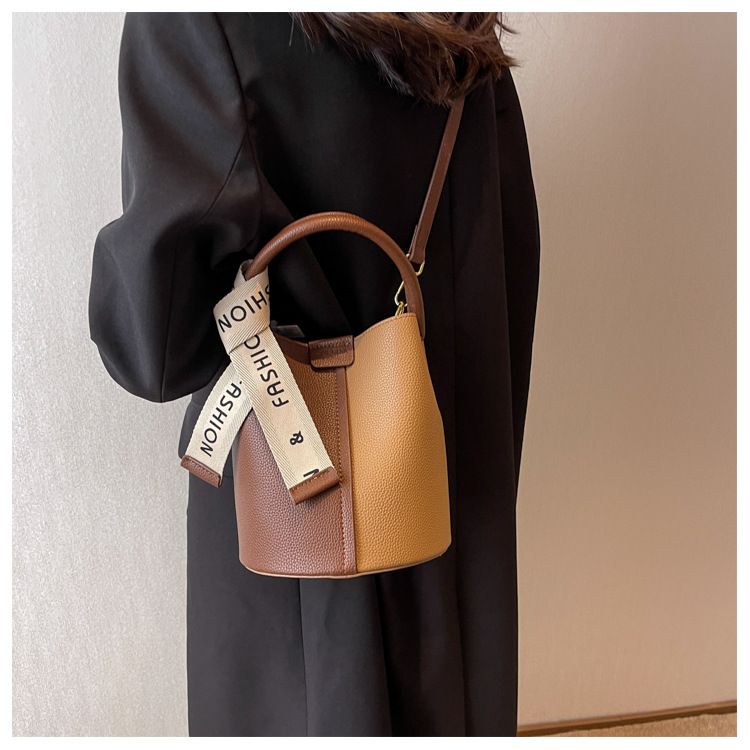 New portable bucket bag with niche design, women's color blocked crossbody bag with high aesthetic value, underarm shoulder bag_voghion.com