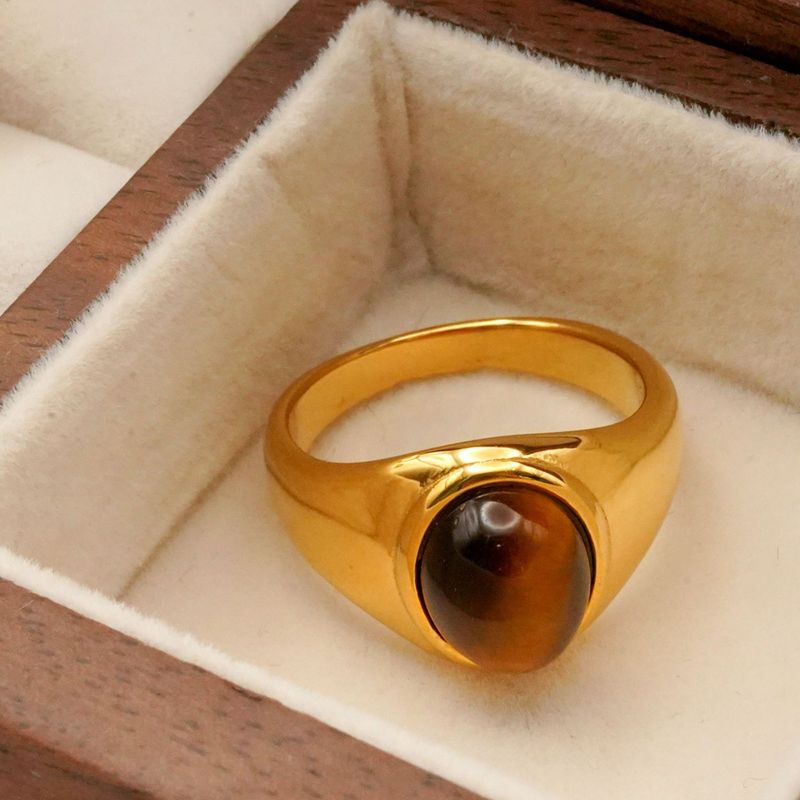Elegante anello in acciaio al titanio con pietra ovale in occhio di tigre in oro inossidabile e ossidiana_voghion.com