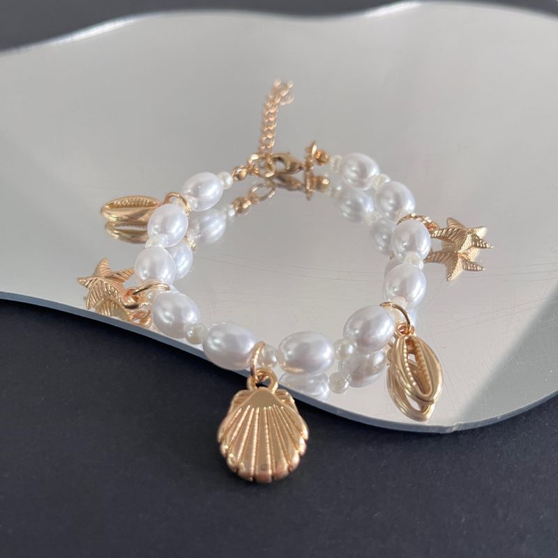 Bracciale da donna con conchiglia a forma di stella marina, in stile estivo, con perle irregolari e serie oceano, gioielli da spiaggia_voghion.com