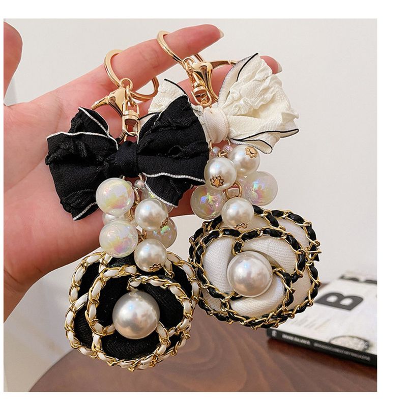 Versione coreana Candy Zhushan Camelia Fiocco in tessuto fatto a mano Portachiavi per auto Ciondolo per borsa Piccolo regalo_voghion.com