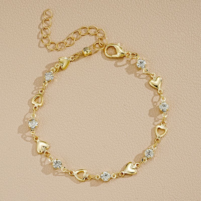 Neues eingelegtes Zirkonarmband für Frauen, einfaches Nischendesign, hohler herzförmiger Schmuck_voghion.com