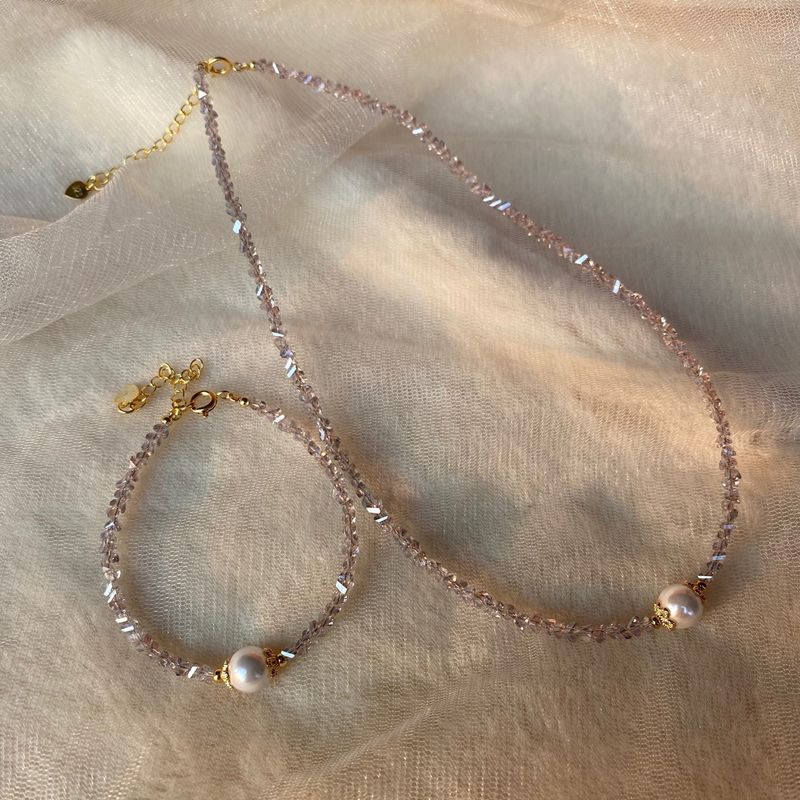Collana irregolare di ametista grigia Bracciale di perle di conchiglia Orecchini semplificati in edizione coreana Set di gioielli in tre pezzi_voghion.com