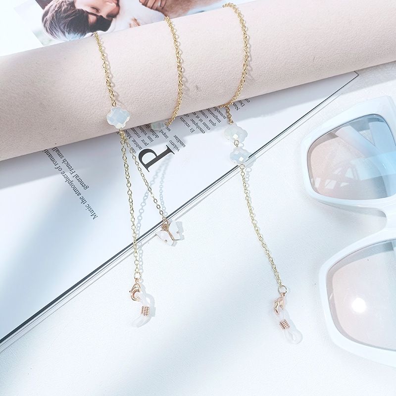 Cadena para gafas sencilla con máscara de retención de color dorado y trébol de cuatro hojas de alta gama._voghion.com