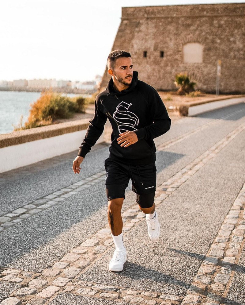 Pantaloncini sportivi alla moda a doppio strato per l'allenamento da uomo falso in due pezzi da basket in esecuzione fitness capris_voghion.com