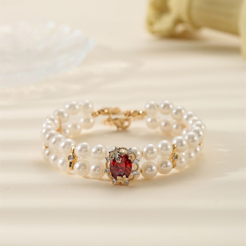 Buntes, mit Edelsteinen eingelegtes, mehrreihiges Perlenarmband in olivgrünem Zirkonia_voghion.com