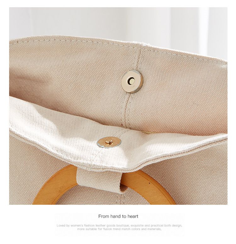 Borsa versatile e di grande capienza in versione coreana, la nuova borsa da donna minimalista in tela di quest'anno, manico in legno_voghion.com