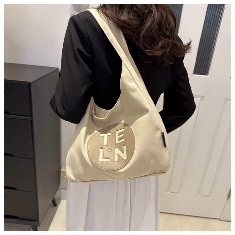 2024 Primavera Nuova Bellissima Borsa Tote in Tela Personalizzata Grande Capacità Moda Donna Borsa a Tracolla Singola per Pendolari_voghion.com