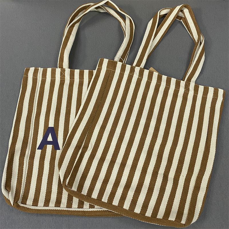 Bolsa de compras unissex de lona com listras verticais Lotte Korea AP_voghion.com