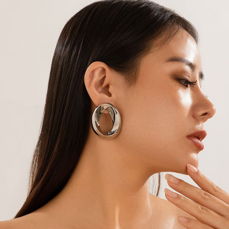 Personality metal geometric texture hollow earrings female irregular twisted glossy earrings earrings_voghion.com