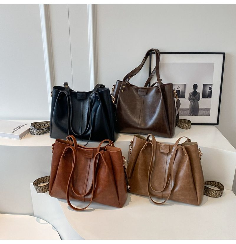 Tote per pendolari retrò di grande capacità in Europa e negli Stati Uniti 2023 nuova tracolla a tracolla con tracolla larga con texture a mano_voghion.com