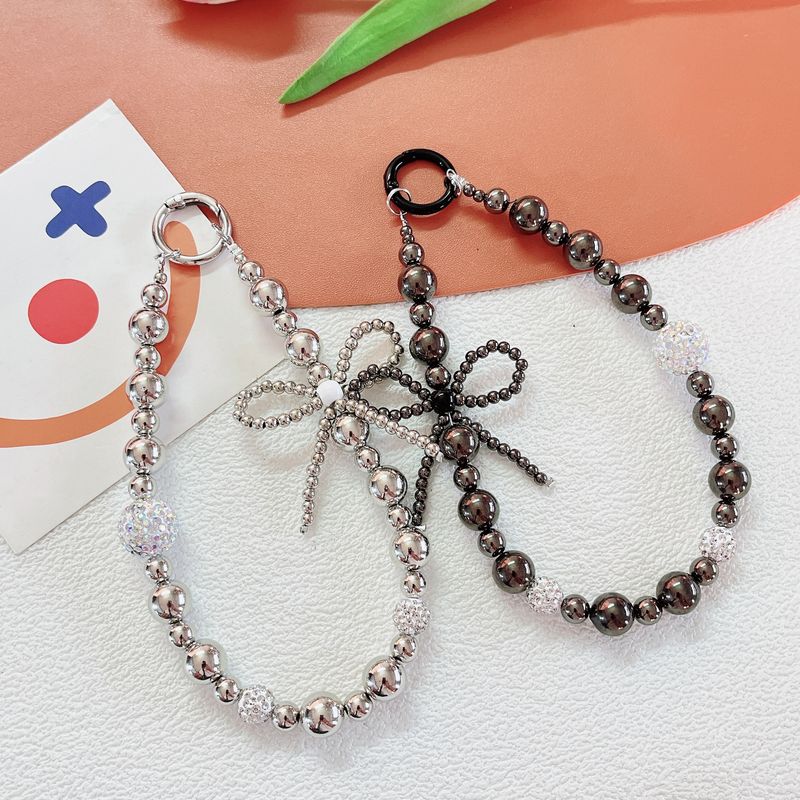 Light Luxury Style Electroplated Bow Inlaid Diamond Beads Mobile Phone Chain Student Bag Pendant_voghion.com