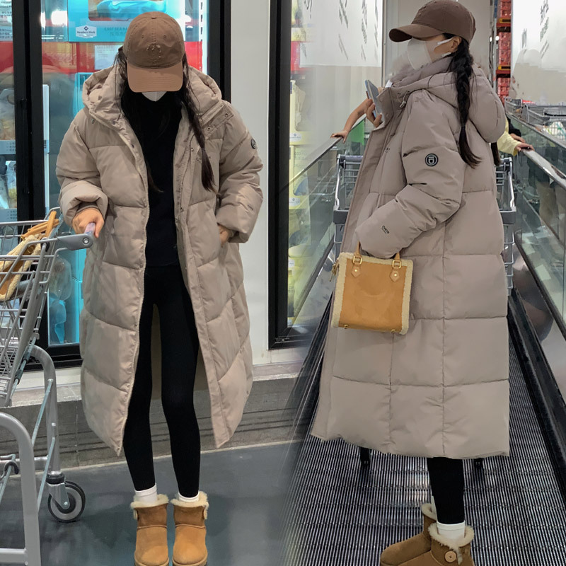 Damesmode in de lange dikke losse damesjas met capuchon_voghion.com