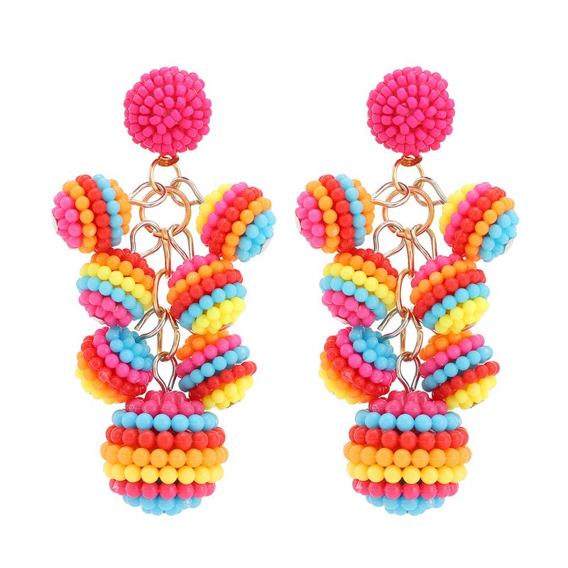 Orecchini con perline di riso fatti a mano in stile etnico con ciondolo a palla lunga bohémien per donna_voghion.com