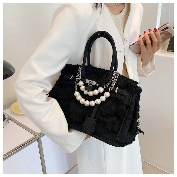 A niche design pearl women's chain bag with a new vintage rag beggar platinum single shoulder crossbody light luxury handbag_voghion.com