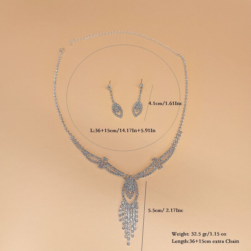 Set di gioielli con strass - Collana, orecchini e bracciale da 3 pezzi, elegante design a catena con griffe per donna_voghion.com