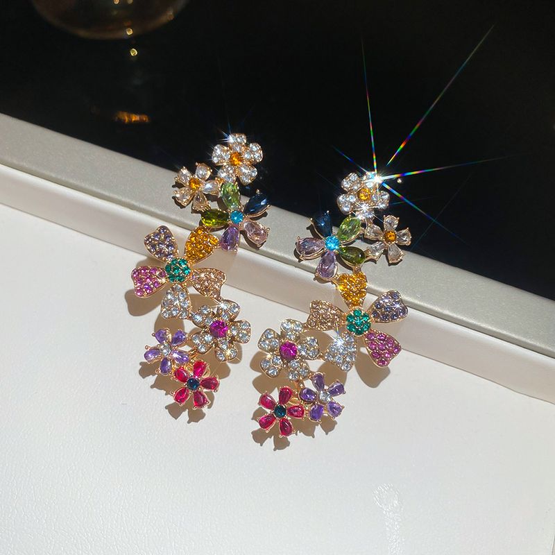 Orecchini a clip con fiore in argento placcato oro vero, luce integrata, lusso, alta moda, nicchia_voghion.com