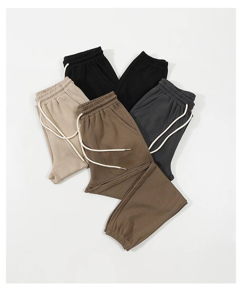 Spodnie dresowe unisex z elastycznego materiału twill z troczkami w pasie – wygodny, luźny krój dla mężczyzn i kobiet (czarny, khaki, ciemnoszary, głęboki beż)_voghion.com