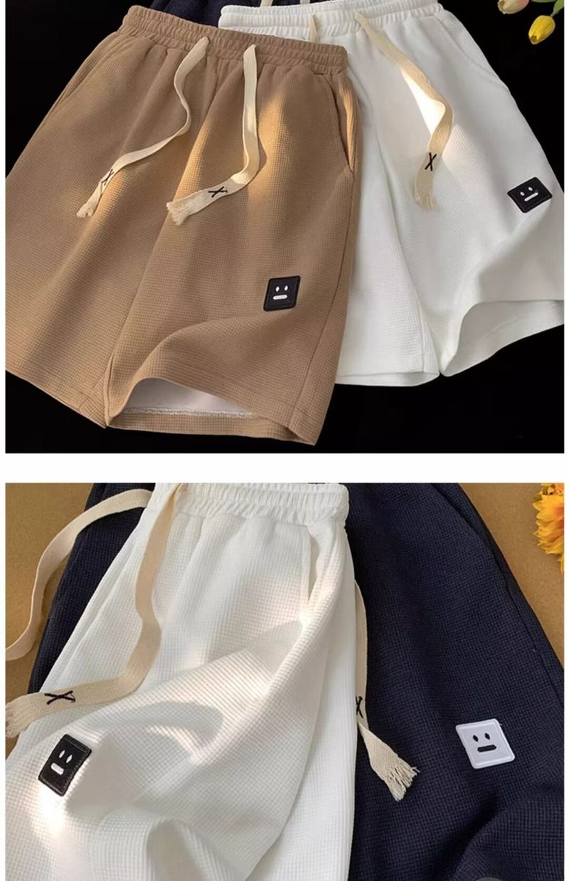 Férfi ruházat 2024 nyári nagy méretű gofri nadrág sport divatmárka rugalmas derék rövidnadrág férfi vékony hétköznapi laza ötpontos nadrág_voghion.com