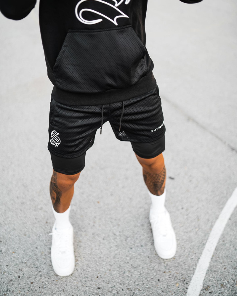 Pantaloncini sportivi alla moda a doppio strato per l'allenamento da uomo falso in due pezzi da basket in esecuzione fitness capris_voghion.com