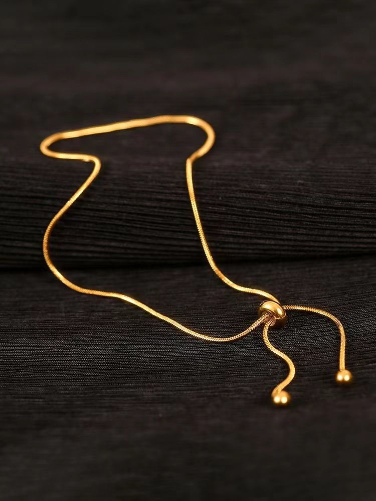 Bohemian Ethnic Snake Bone Pull Foot Chain Female Titanium Steel Non-fading Light Luxury Niche Design Bare Chain Adjustable High-end Foot Decoration_voghion.com