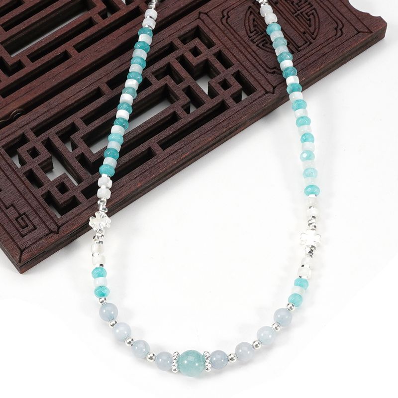 Di perle rotonde in pietra naturale con ciondolo a forma di quadrifoglio a quattro foglie e cristallo blu sfaccettato_voghion.com