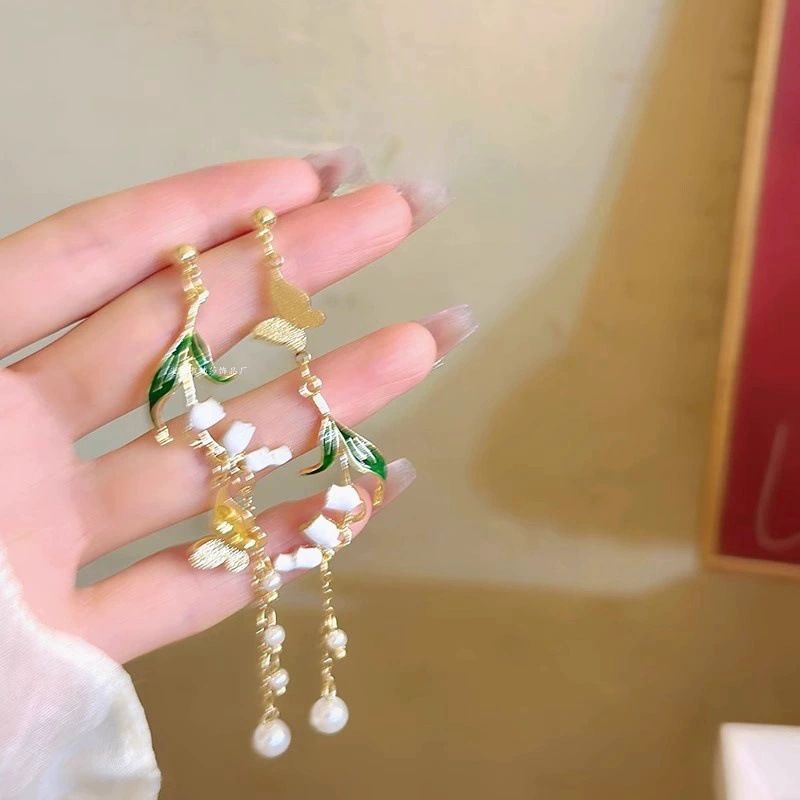 Orecchini a spirale antizanzara con nappa lunga in stile foresta di osmanto dorato autunnale, design di nicchia dolce, ganci per orecchini di alta qualità_voghion.com