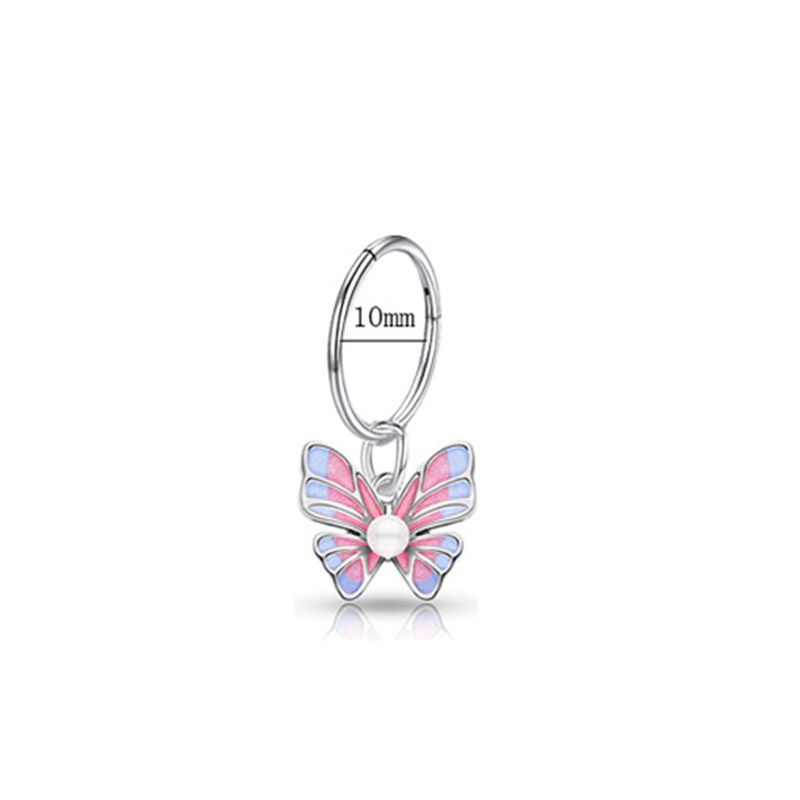 Piercing de ombligo con diseño de mariposa, micro pavé de circonitas, sin costuras. Disponible._voghion.com