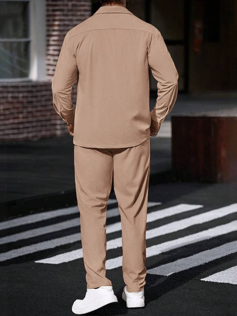 Completo sportivo casual da uomo in due pezzi con semplice giacca con risvolto, tasca con bottoni e pantaloni dritti_voghion.com