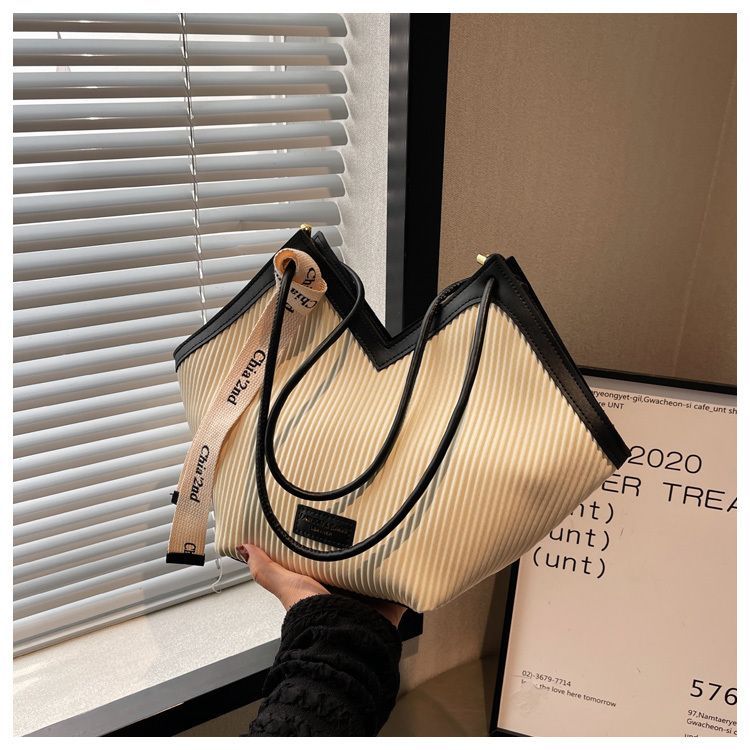 Borsa tote per studenti a spalla singola da pendolarismo in pelle versatile e casual da donna famosa su Internet del 2024 di grande capacità_voghion.com