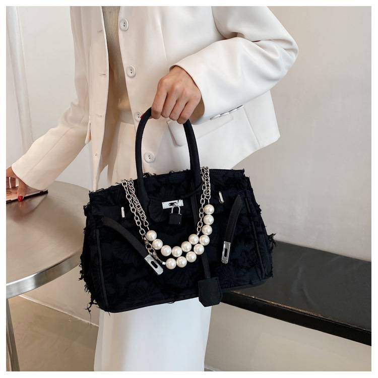 A niche design pearl women's chain bag with a new vintage rag beggar platinum single shoulder crossbody light luxury handbag_voghion.com