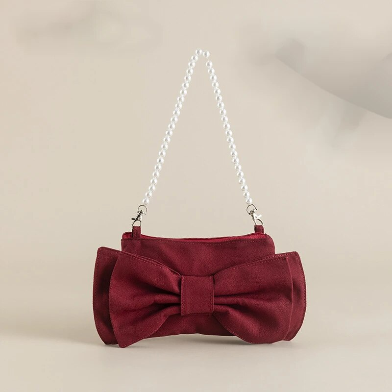 Nuevo bolso de lona con cadena de perlas y lazo con diseño de nicho. Bolso de hombro popular en Instagram, moderno y bonito._voghion.com