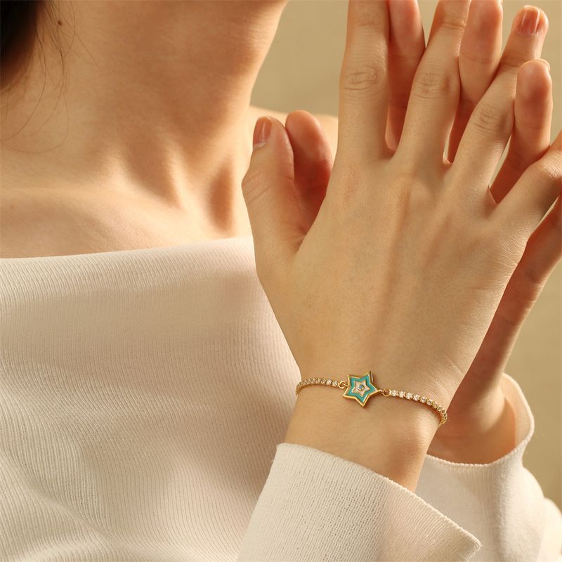 Neues Kreuzstift-Kupfer-Tropfen-Teufelsauge-Armband, kleiner Fisch, Palme, blaues Auge, Zirkon-Zugarmband für Damen auf Lager_voghion.com