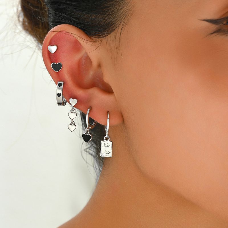 Boucles d'oreilles pour femmes de style universitaire minimaliste noir avec un design d'amour de niche et d'huile dégoulinante, boucles d'oreilles haut de gamme, boucles d'oreilles polyvalentes_voghion.com