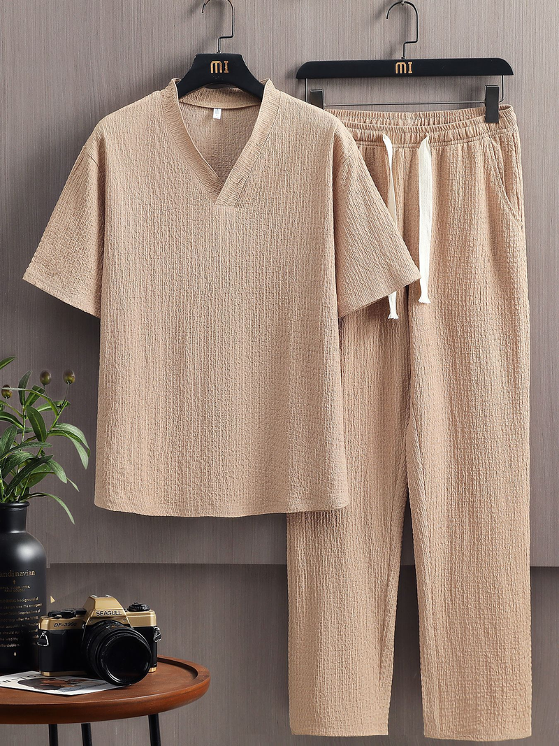 Un nuovo completo sportivo casual estivo da uomo europeo e americano con maniche corte e pantaloni lunghi in tinta unita, composto da due pezzi._voghion.com